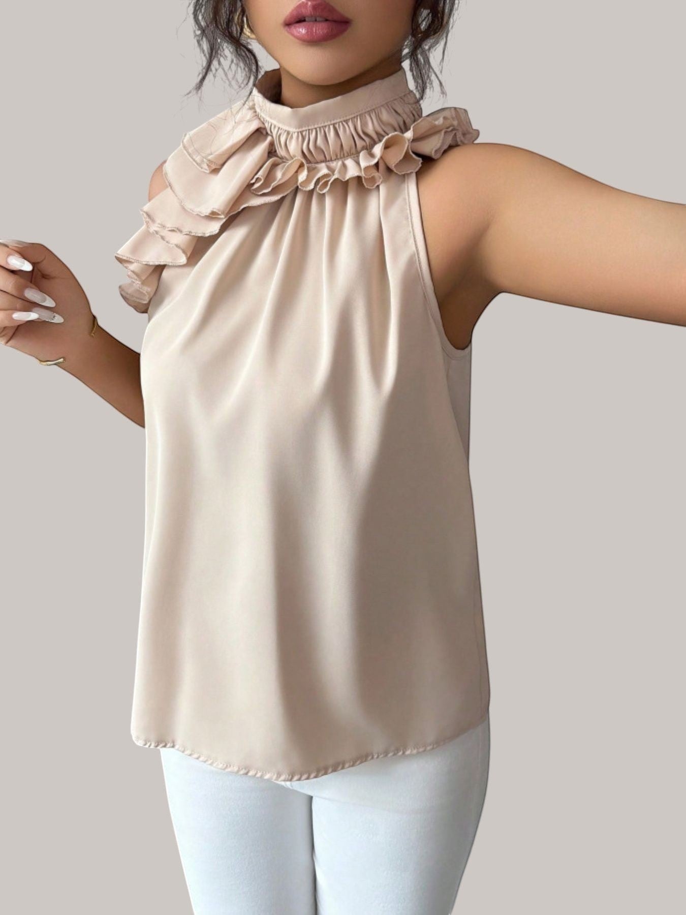 MICHEL beige sleeveless high neck top with ruffled collar detail in 100% polyester worn by a model