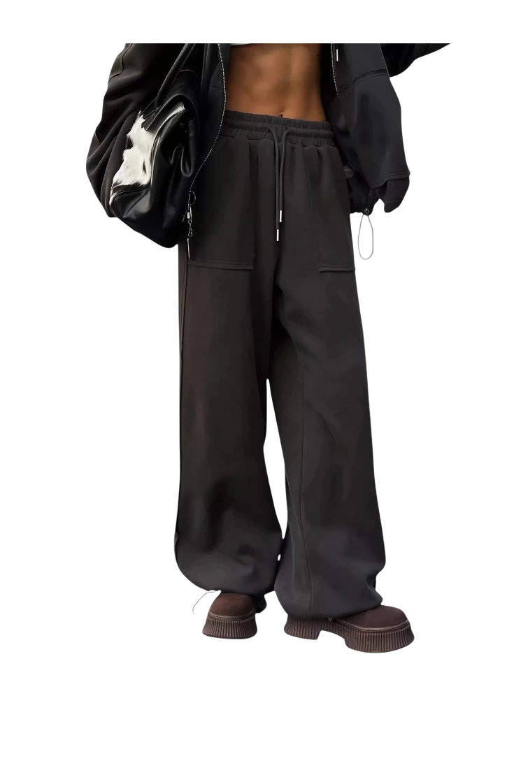 MICHEL oversized black zip-up hoodie and wide-leg drawstring pants set with pockets on a model