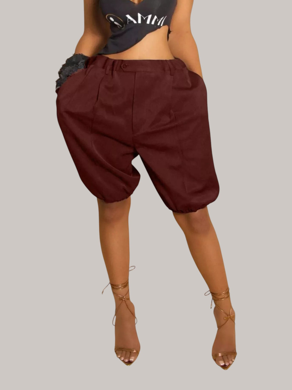 MICHEL high waist pleated shorts in dark burgundy polyester blend with drawstring and side pockets on a model