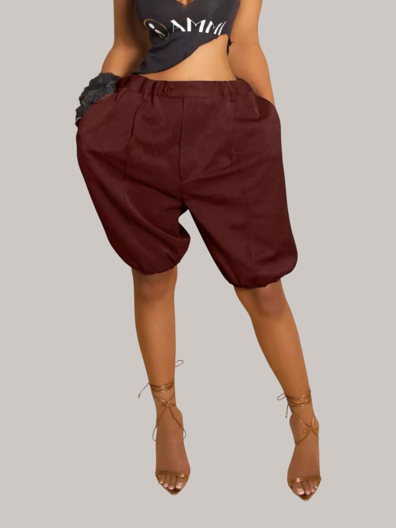 MICHEL high waist pleated shorts in dark burgundy polyester blend with drawstring and side pockets on a model