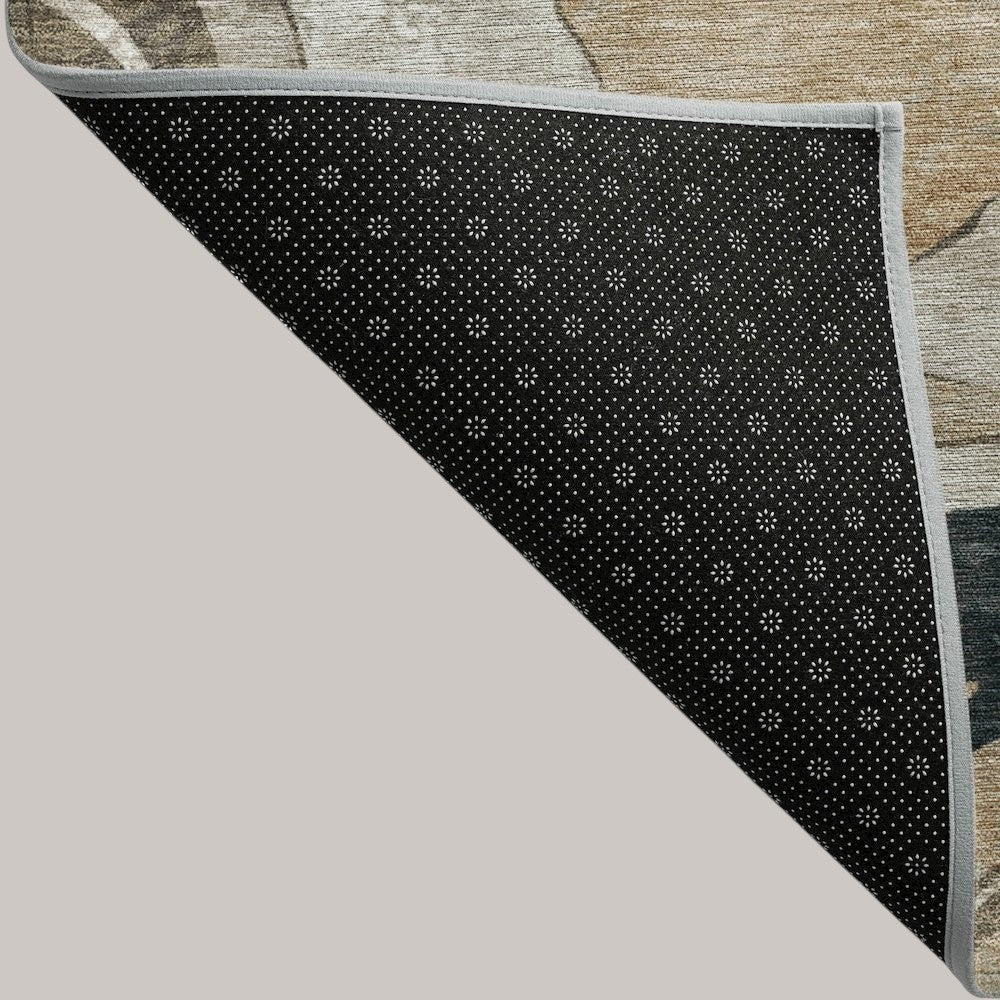MICHEL Chantille performance rug corner showing the black non-slip backing and abstract putty-colored flat weave top.