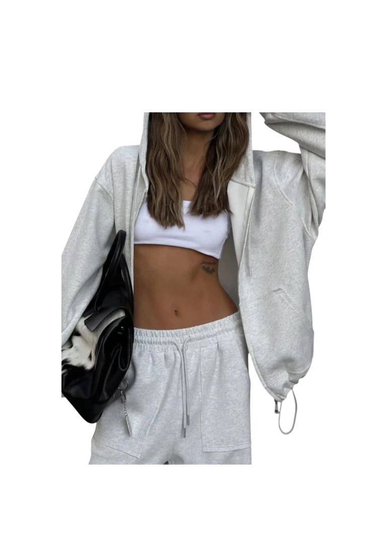 MICHEL oversized grey zip-up hoodie and matching wide-leg drawstring pants set worn with a white crop top