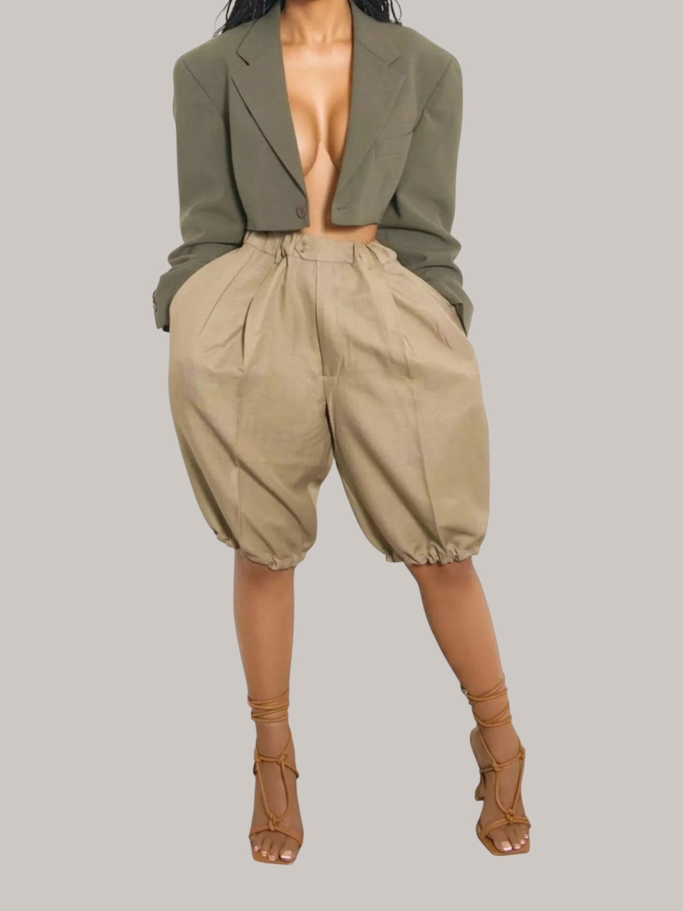 MICHEL high-waisted beige pleated shorts with drawstring and pockets paired with a cropped olive blazer