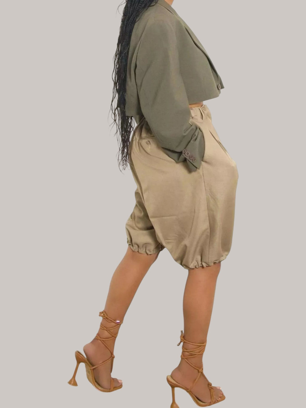 MICHEL high waist pleated shorts in beige with drawstring and pockets, paired with a cropped olive green blazer.