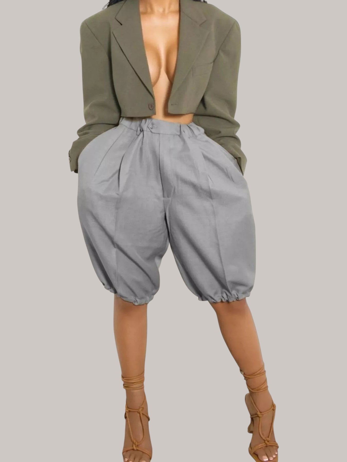 MICHEL high waist grey pleated shorts with drawstring and pockets paired with a cropped olive blazer