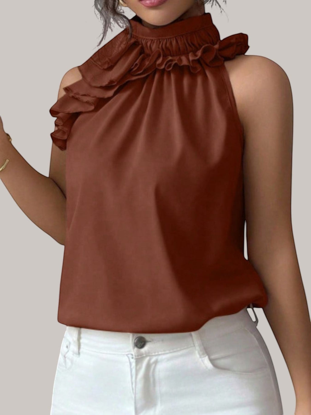 MICHEL sleeveless top in rust brown with a high ruffled neck and button detail, worn by a model.