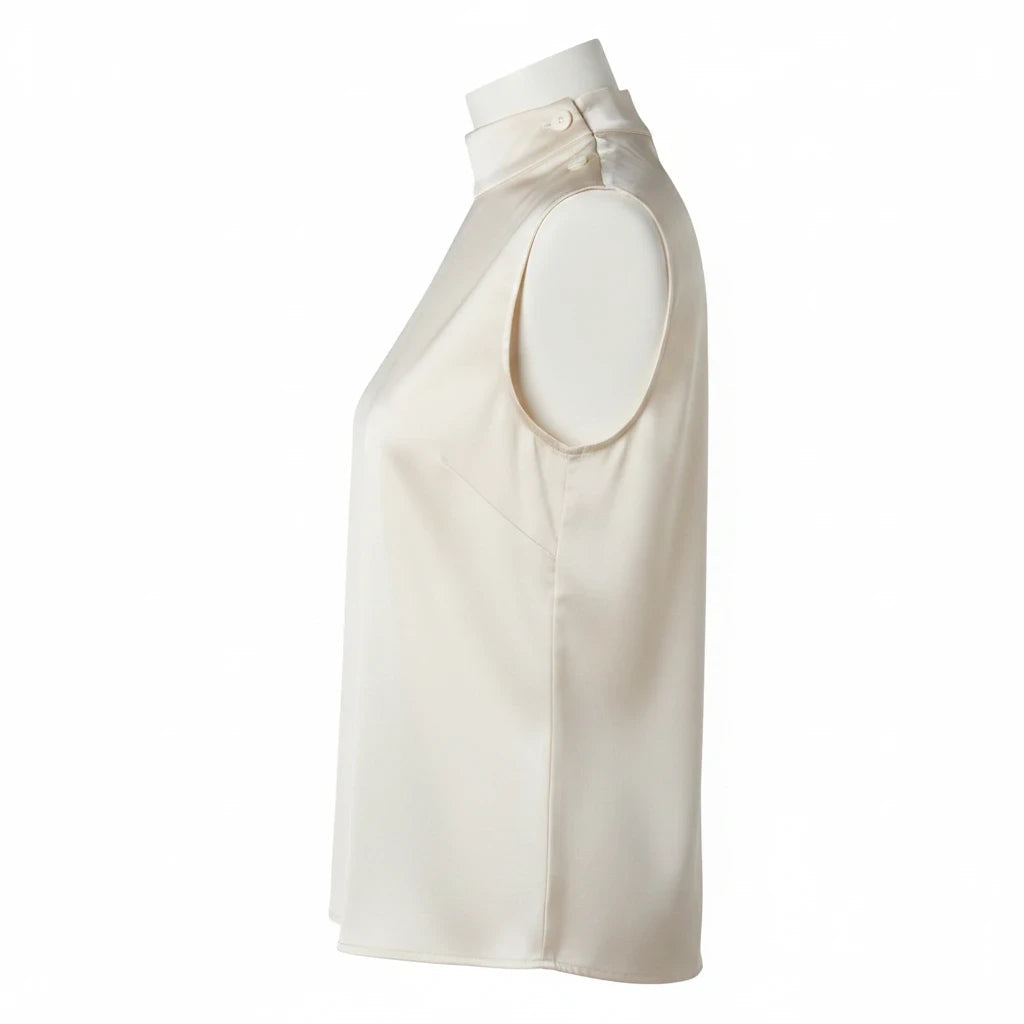 MICHEL sleeveless satin mock neck blouse in cream with shoulder button detail, side view on mannequin