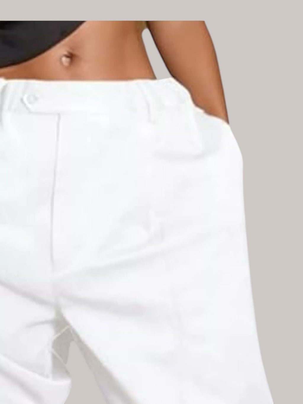 MICHEL white high-waisted pleated shorts with side pockets worn by a model