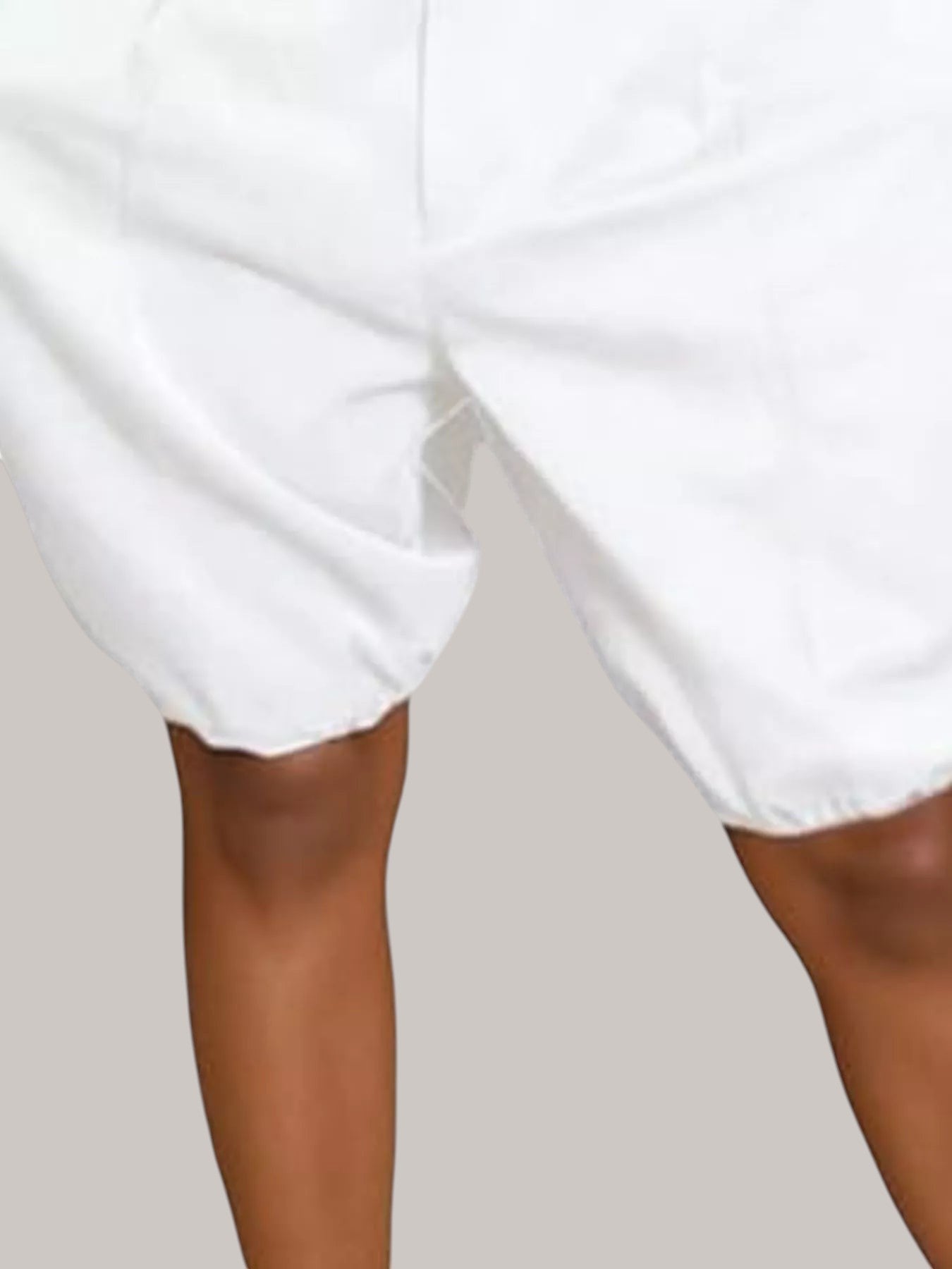 MICHEL white high-waisted shorts featuring pleated details and a comfortable drawstring waist.