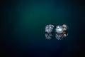 A pair of round-cut diamond stud earrings in a silver-toned setting, displayed on a reflective dark blue surface against a dark teal background.